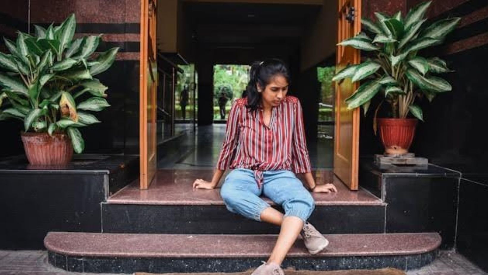 Person sitting on stairs 